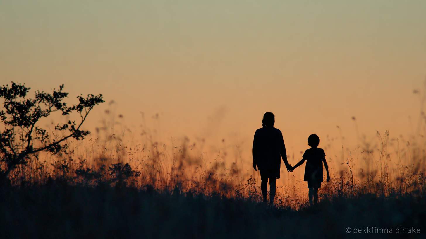 Mother and daughter at sunrise
