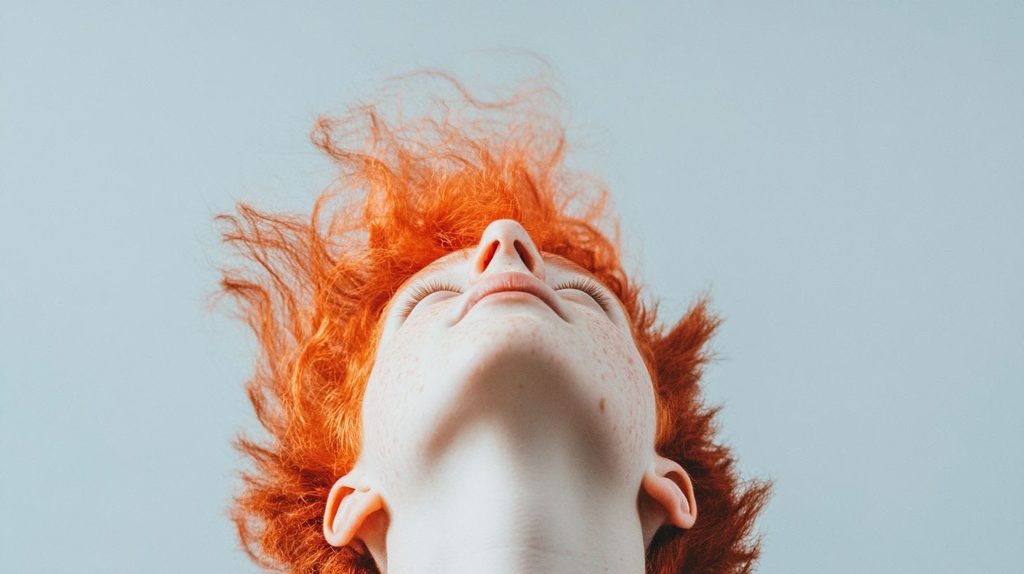 Red haired person looking up
